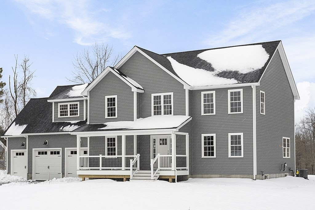 182 Davis Road Westminster, MA 01473 - Photo 2 of 42 a view of a white house with large windows