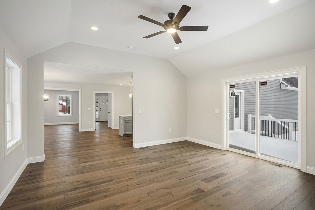 182 Davis Road Westminster, MA 01473 - Photo 22 of 42 an empty room with wooden floor and windows