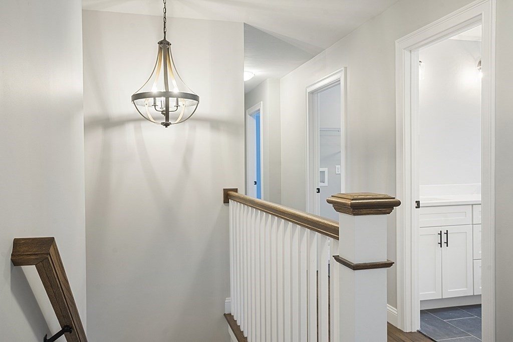 182 Davis Road Westminster, MA 01473 - Photo 27 of 42 a view of a hallway with chandelier