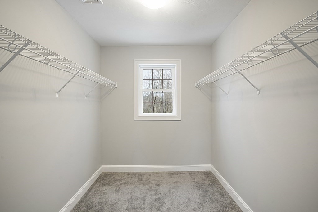 182 Davis Road Westminster, MA 01473 - Photo 29 of 42 a view of a room with rack on the wall and a window