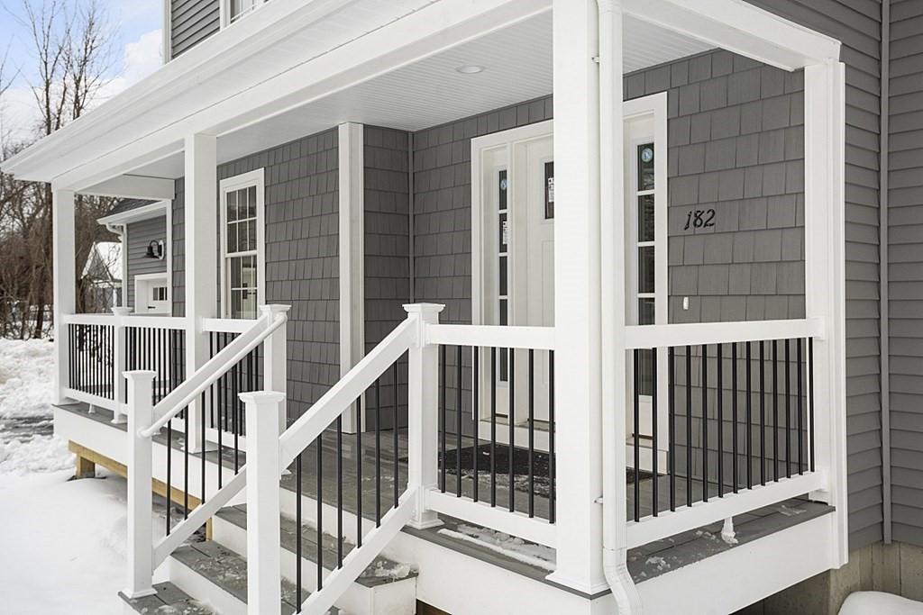 182 Davis Road Westminster, MA 01473 - Photo 3 of 42 a view of staircase with white walls and windows