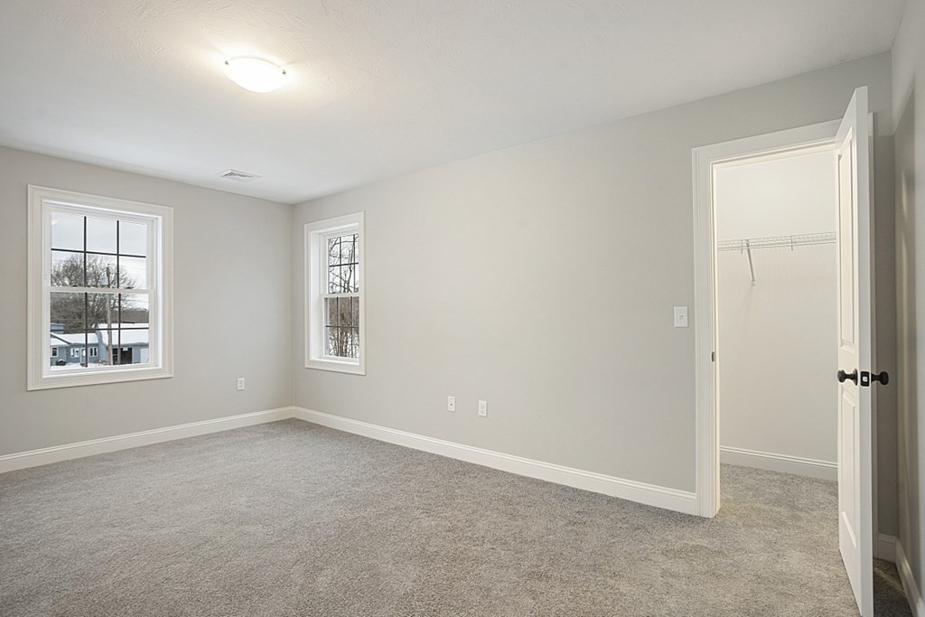 182 Davis Road Westminster, MA 01473 - Photo 32 of 42 an empty room with windows and closet