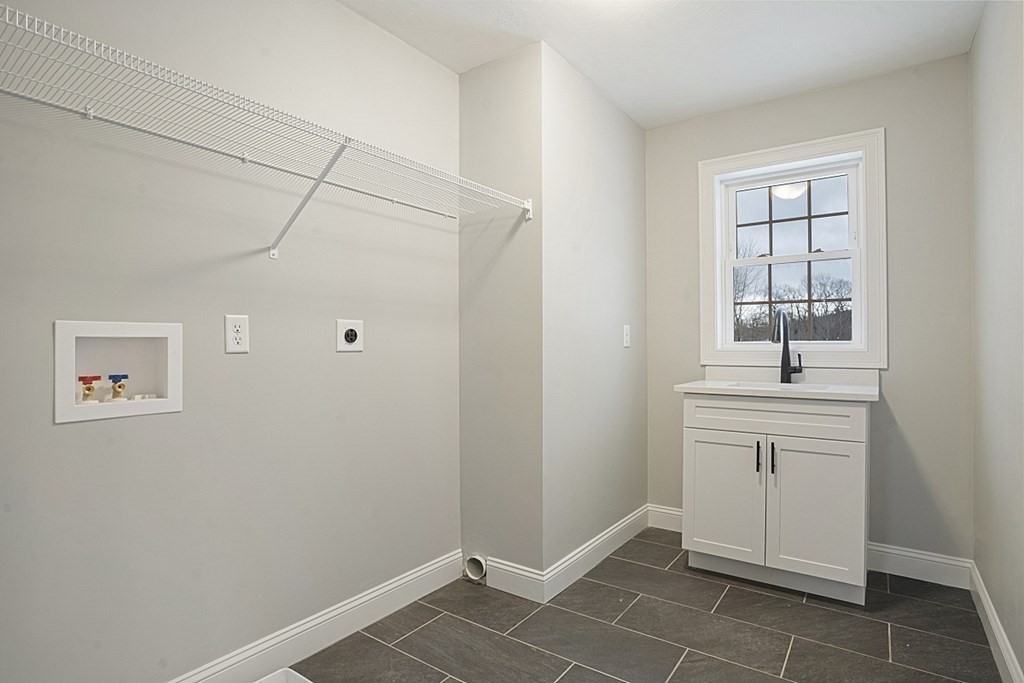 182 Davis Road Westminster, MA 01473 - Photo 35 of 42 a view of an empty room with window and cabinet
