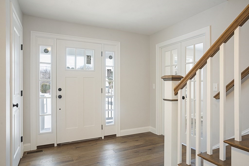 182 Davis Road Westminster, MA 01473 - Photo 5 of 42 a view of an entryway with wooden floor and stairs