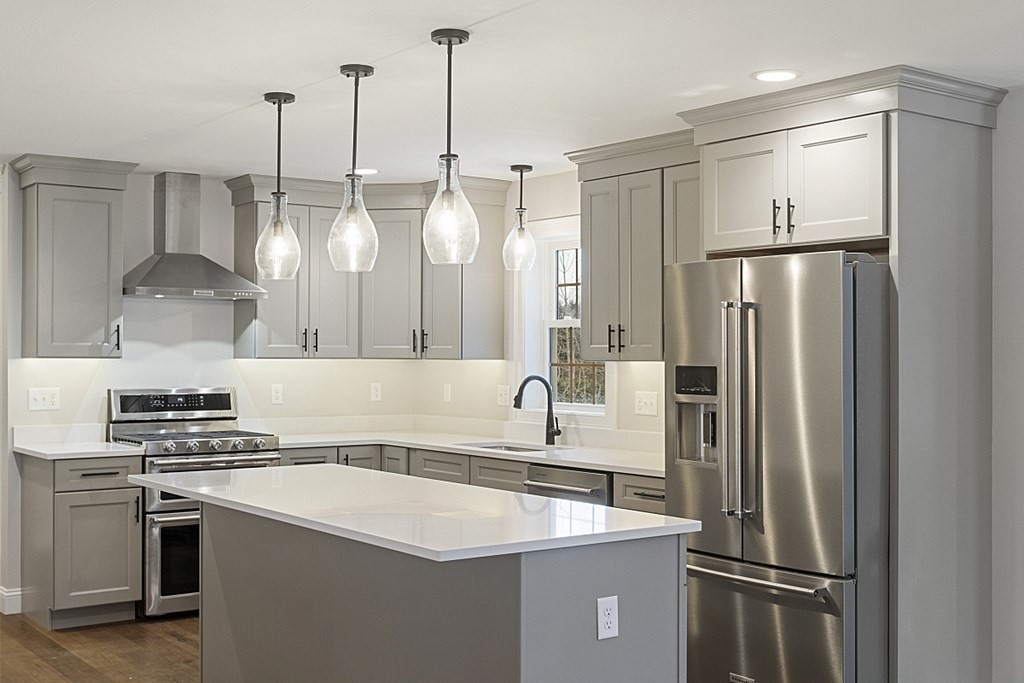 182 Davis Road Westminster, MA 01473 - Photo 7 of 42 a kitchen with stainless steel appliances a refrigerator sink and stove