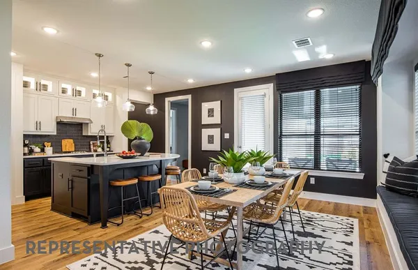 a spacious bedroom with a bed and cabinets