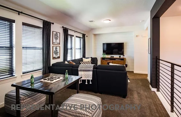 a view of a patio with table and chairs and potted plants