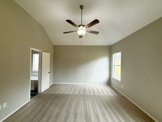 a spacious bathroom with a bathtub shower sink double and mirror