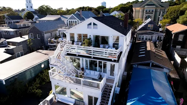 a front view of a residential apartment building with a yard