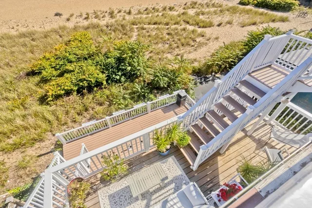 a view of a balcony with furniture