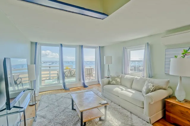 a bedroom with a bed and flat screen tv