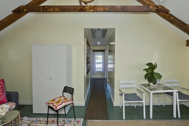 a room with furniture and a flat screen tv