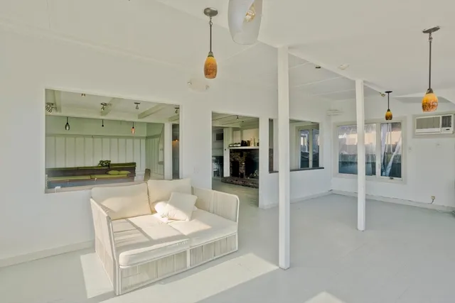 a view of a patio with table and chairs with wooden floor