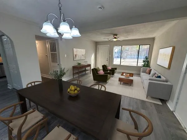 a view of a dining room with furniture and wooden floor