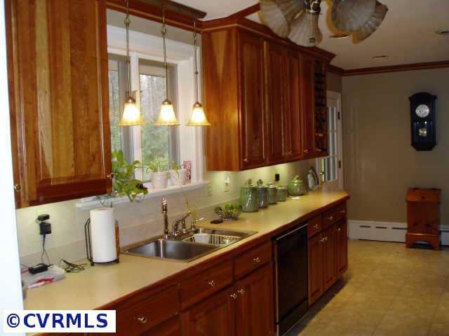 Other - Remodeled kitchen with beautiful cherry cabinets, GE applicances, recessed lighting and door leading to deck overlooking lush gardens