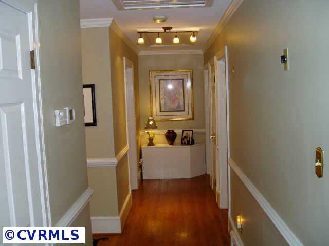 3612 Sherbrook Road Richmond, VA 23235 - Photo 8 of 10 Other - Wide hallway with crown molding, chair rail and decorative track lighting.