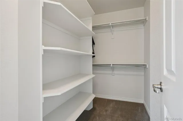 a view of an empty walk in closet