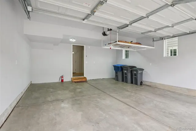 a view of a storage & utility room with two washing machine