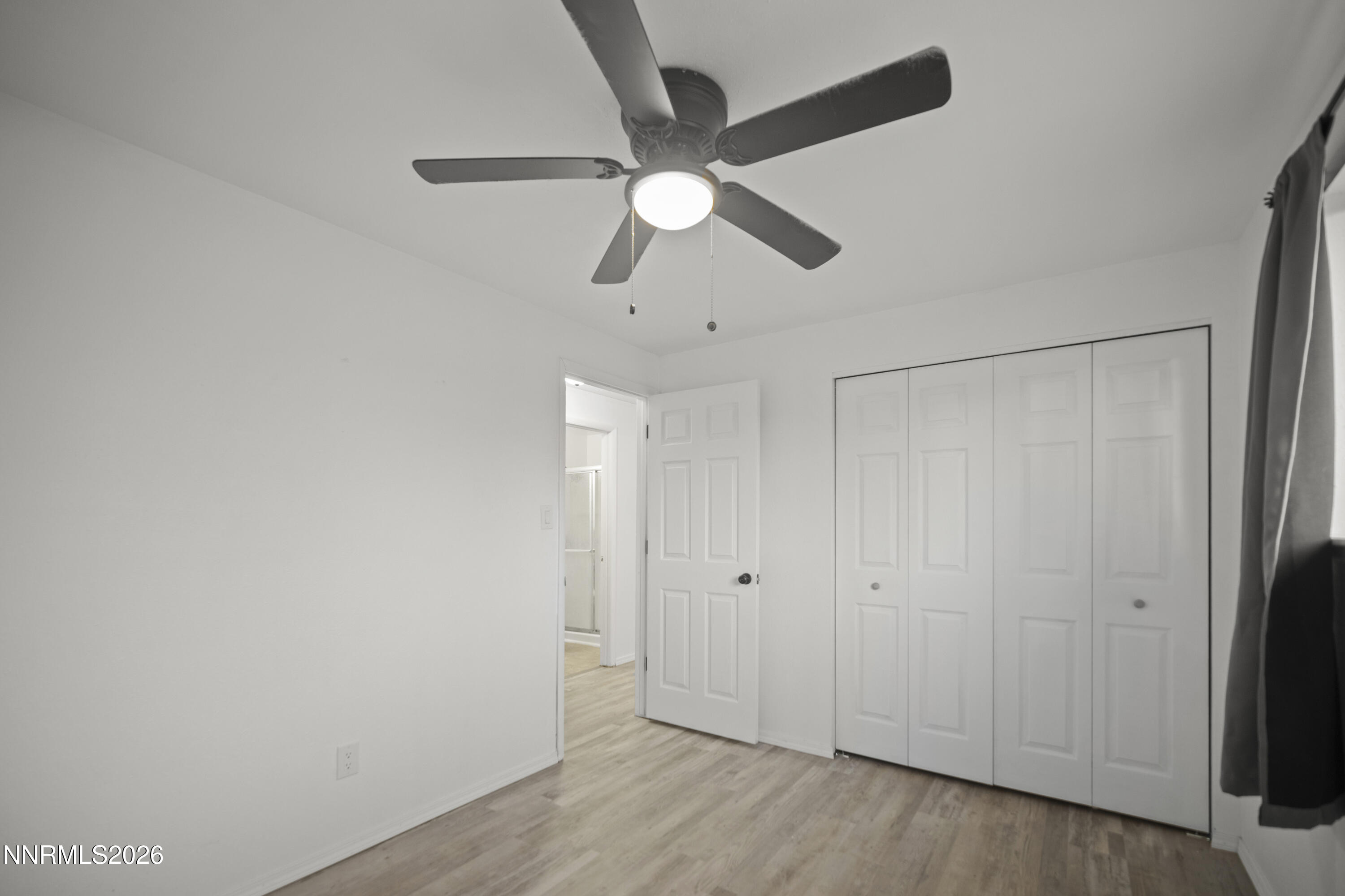 150 McCart Street Fernley, NV 89408 - Photo 14 of 28 a view of a chandelier fan in a room
