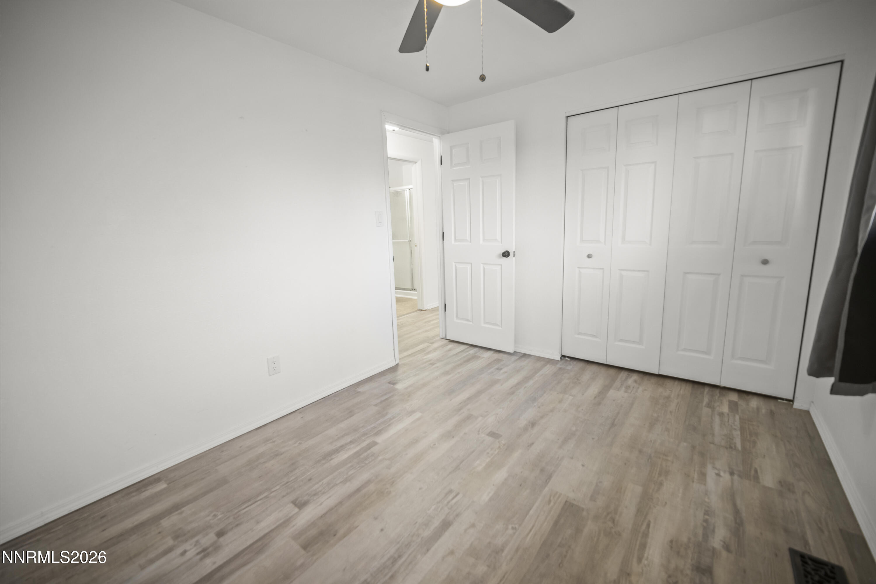 150 McCart Street Fernley, NV 89408 - Photo 15 of 28 a view of an empty room and wooden floor