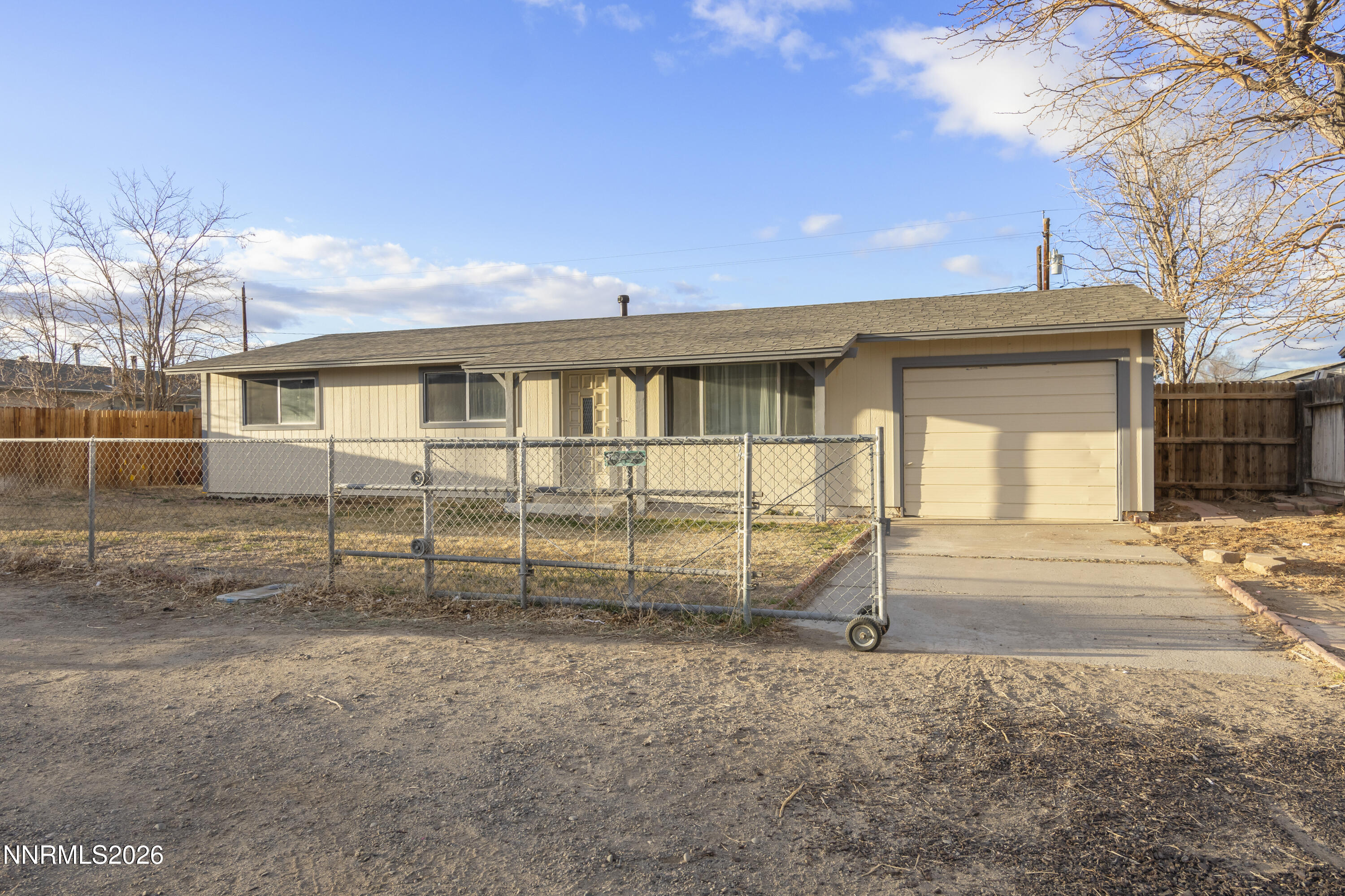 150 McCart Street Fernley, NV 89408 - Photo 2 of 28 a view of a house with a backyard