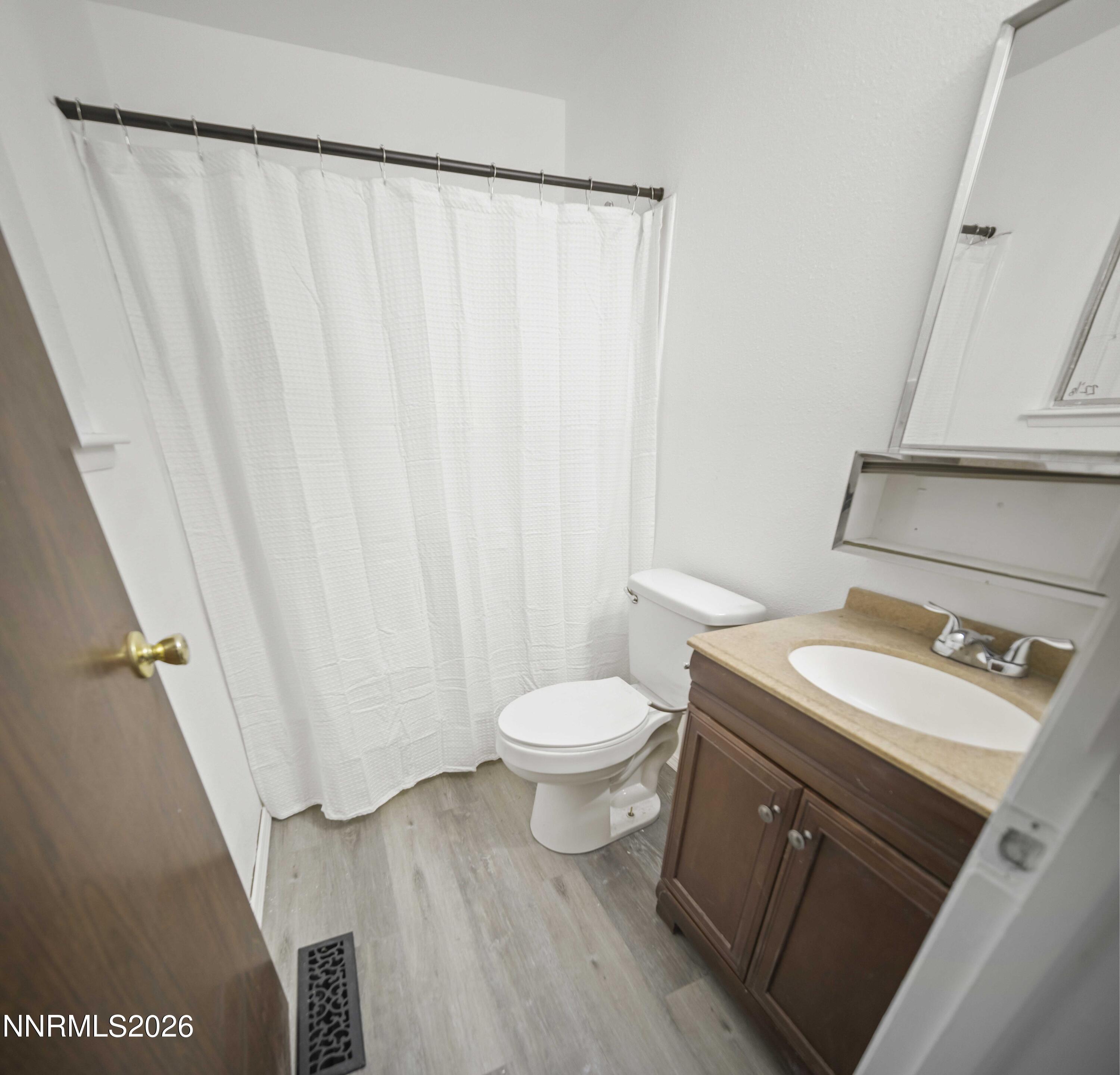 150 McCart Street Fernley, NV 89408 - Photo 21 of 28 a bathroom with a sink a toilet and a shower
