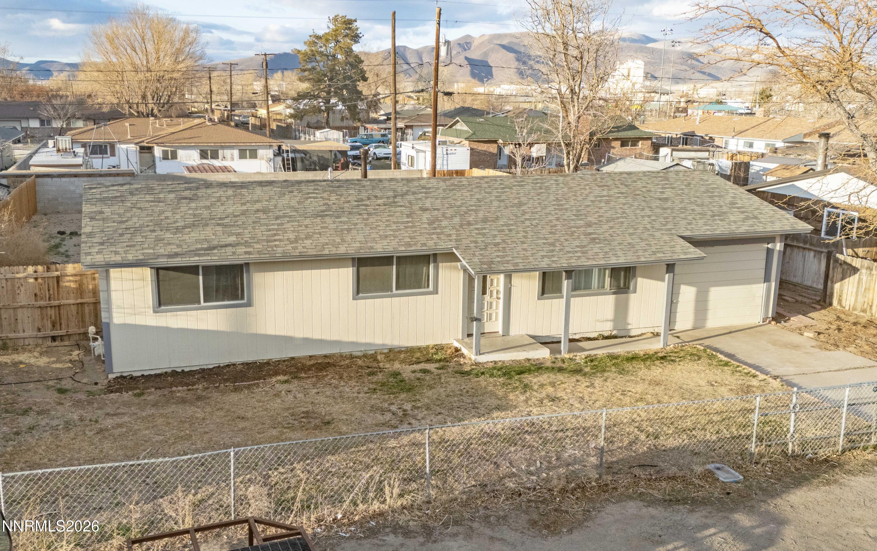 150 McCart Street Fernley, NV 89408 - Photo 25 of 28 a front view of a house with a yard