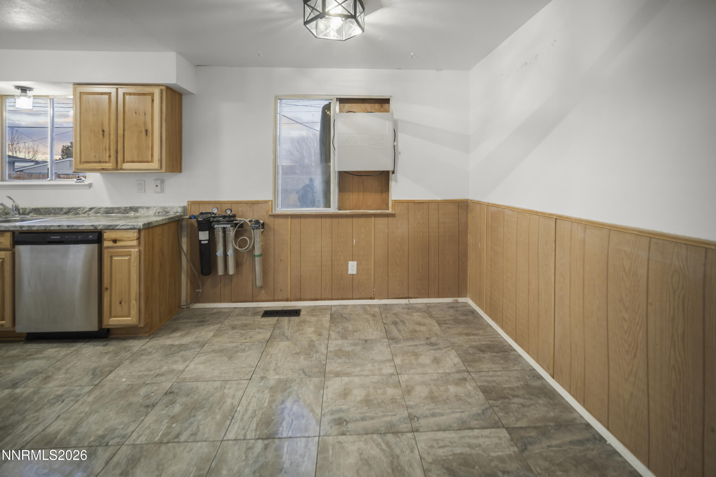 150 McCart Street Fernley, NV 89408 - Photo 8 of 28 a view of a kitchen with granite countertop cabinets and window