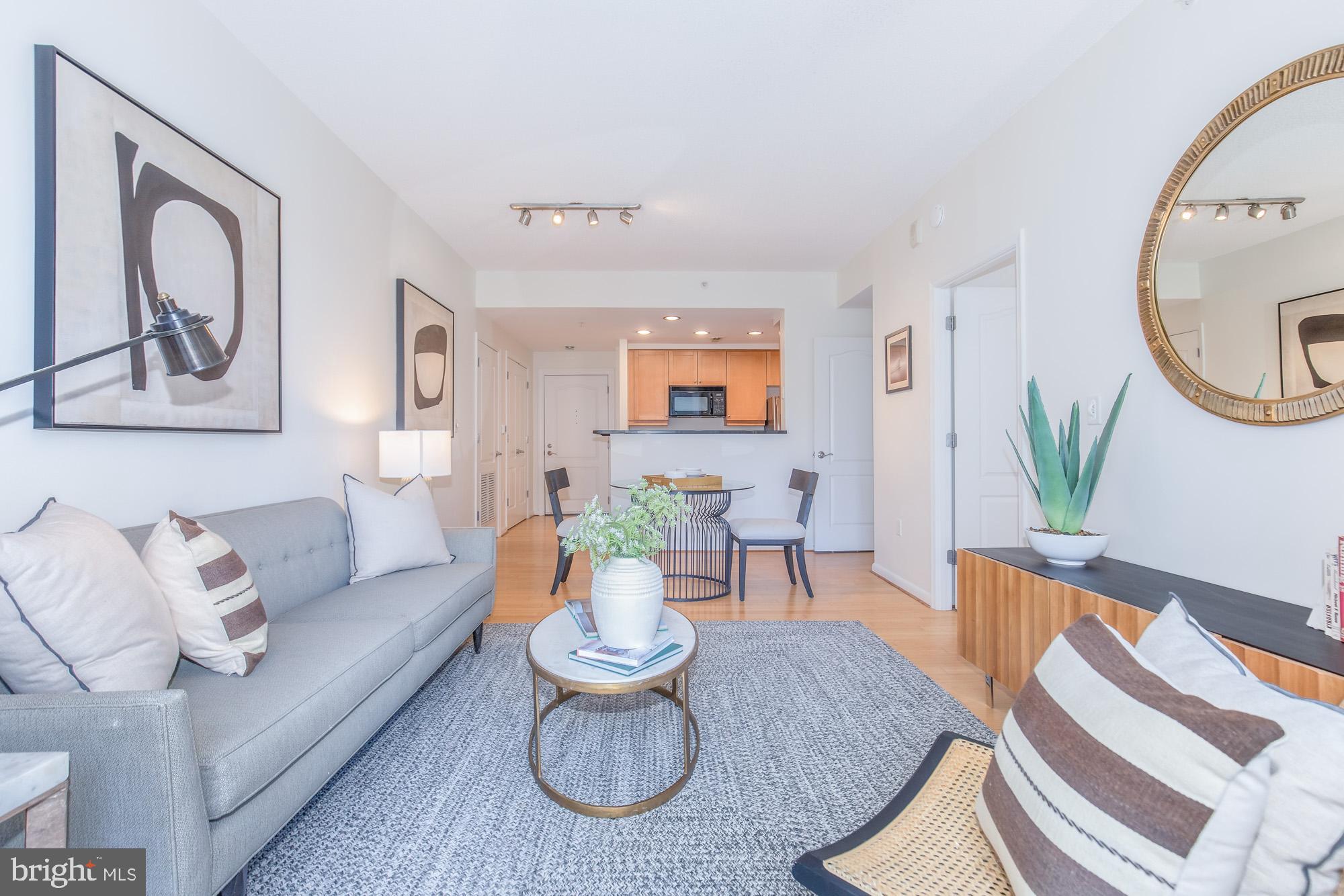 1111 11th Street Northwest, Unit 309 Washington, DC 20001 - Photo 11 of 18 a living room with furniture and wooden floor