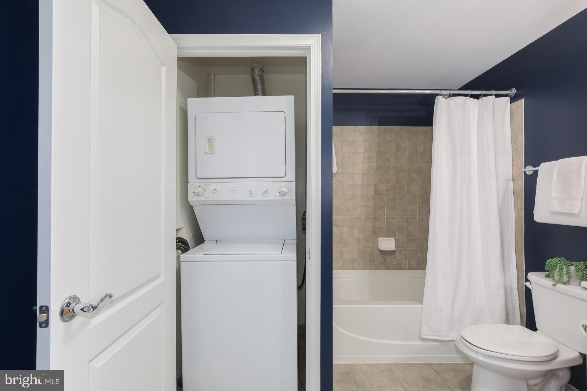 1111 11th Street Northwest, Unit 309 Washington, DC 20001 - Photo 16 of 18 a white toilet sitting next to a bathtub