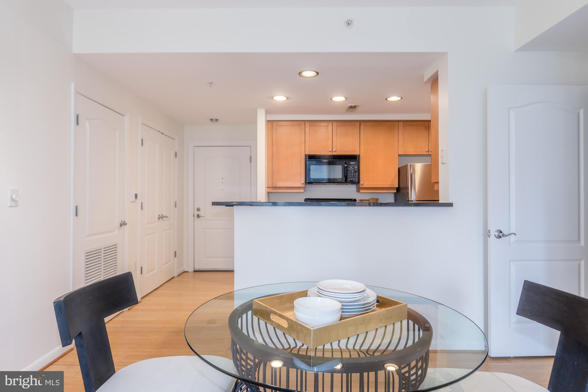 1111 11th Street Northwest, Unit 309 Washington, DC 20001 - Photo 5 of 18 a living room with furniture and a table