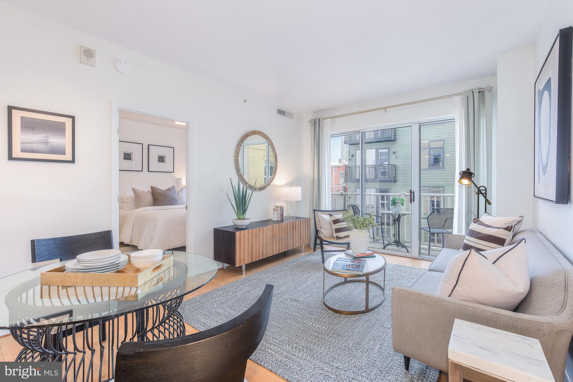 1111 11th Street Northwest, Unit 309 Washington, DC 20001 - Photo 9 of 18 a living room with furniture and wooden floor