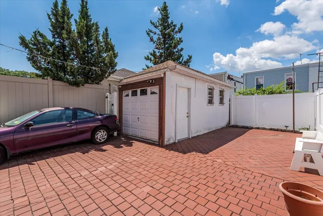 a front view of a house with parking space