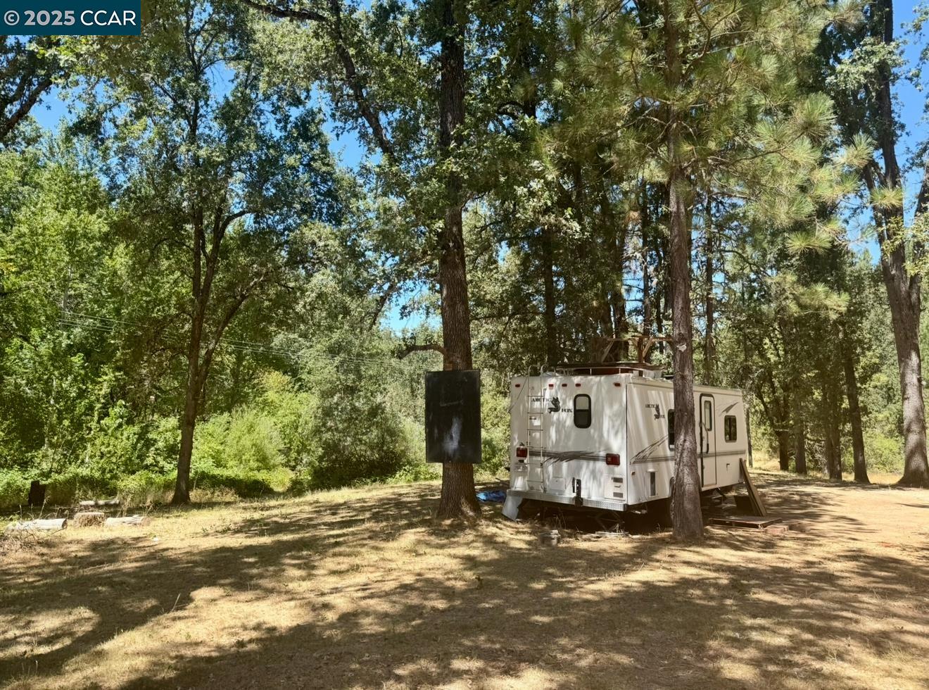 4578 Pretty Good Road Placerville, CA 95667 - Photo 9 of 25 a view of a road with large trees