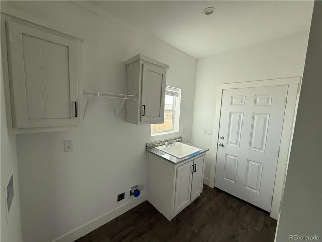 a bathroom with a sink and mirror