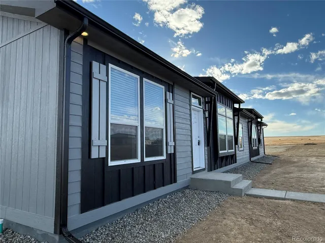 a view of a hallway with chandelier