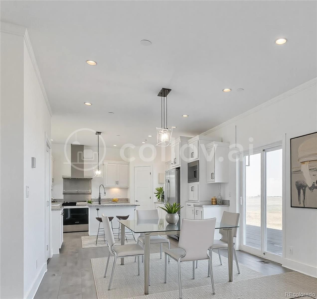 5165 Pass Me By Road Strasburg, CO 80136 - Photo 7 of 24 a view of a dining room kitchen with furniture and a chandelier