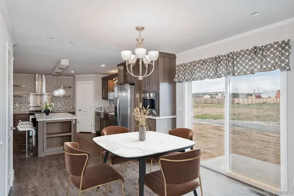 a kitchen with a table and chairs in it