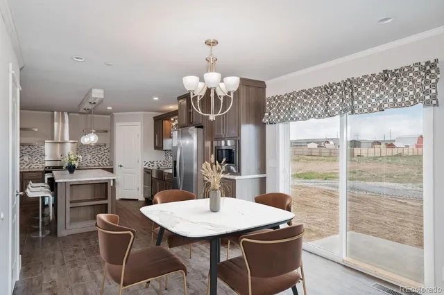 a kitchen with a table and chairs in it