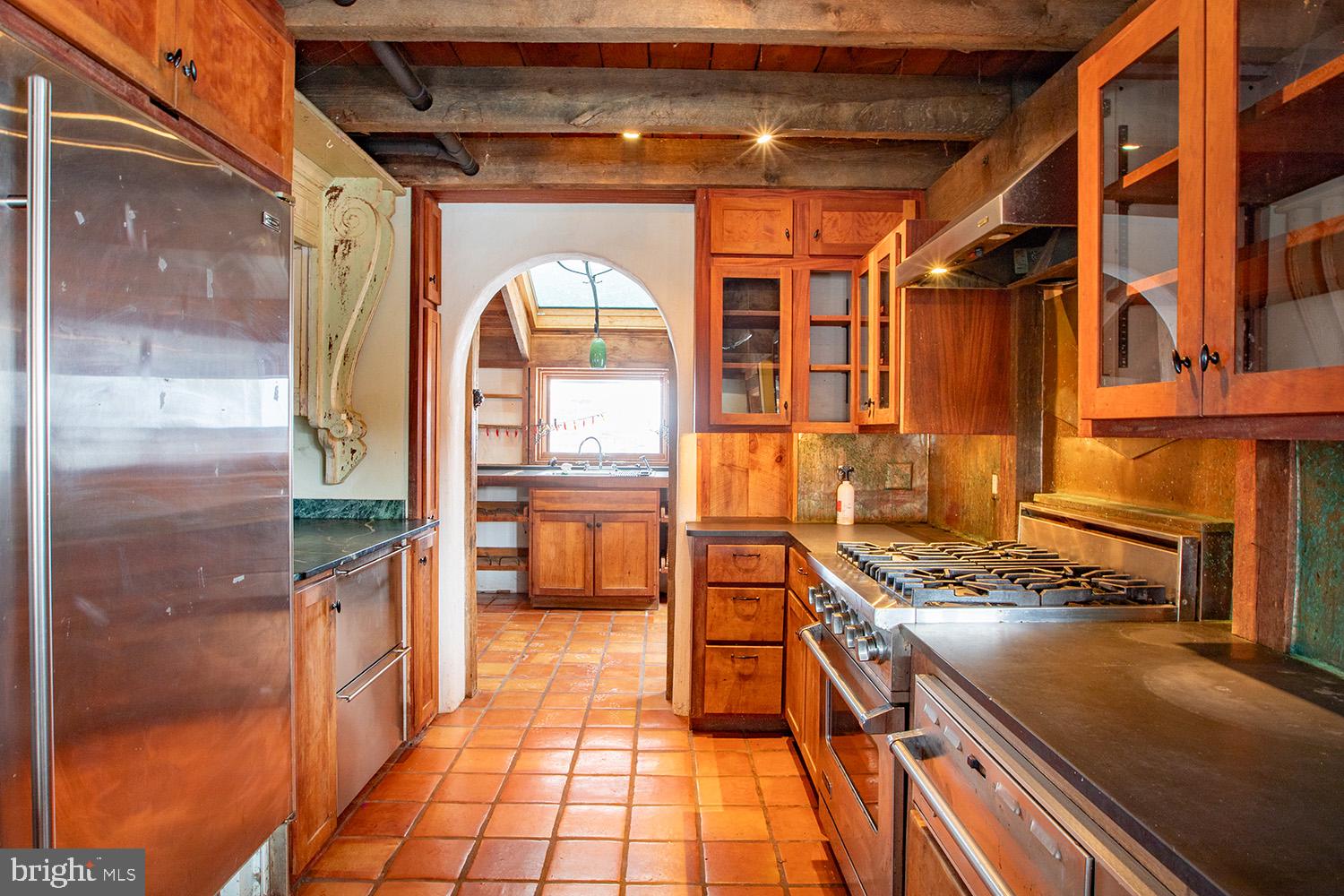 220 Dietrich Road Kempton, PA 19529 - Photo 20 of 90 a kitchen with stainless steel appliances granite countertop a stove and a shower