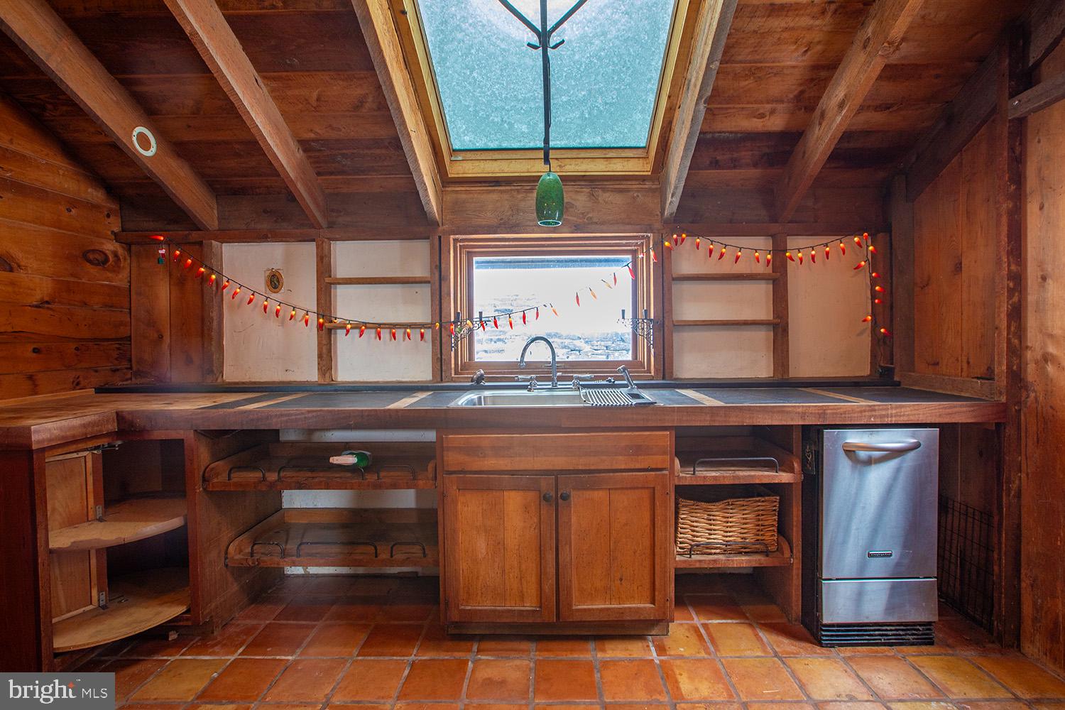 220 Dietrich Road Kempton, PA 19529 - Photo 25 of 90 a kitchen with stainless steel appliances wooden cabinets and a stove top oven