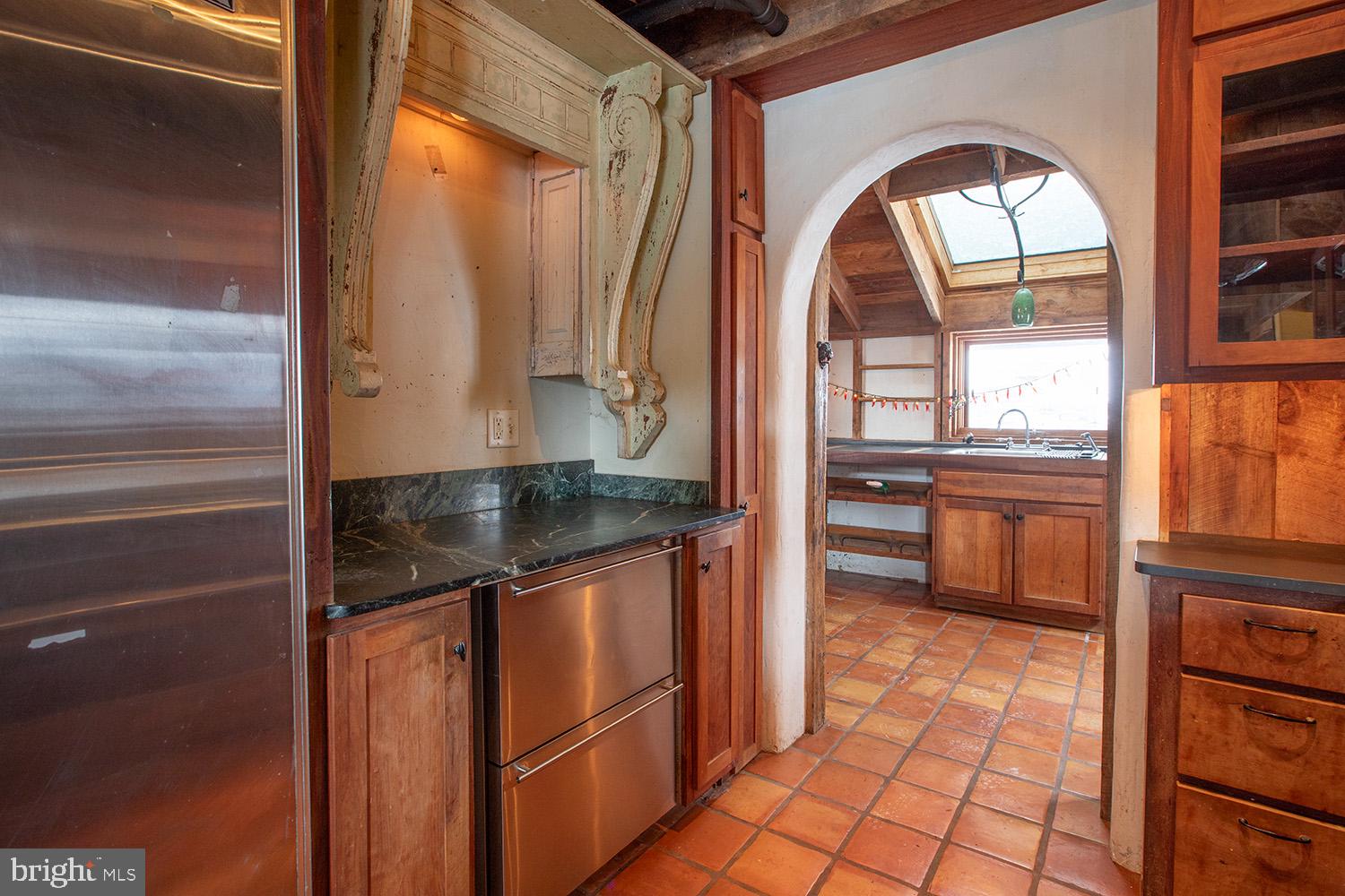 220 Dietrich Road Kempton, PA 19529 - Photo 26 of 90 a kitchen with stainless steel appliances granite countertop a stove a sink and a microwave