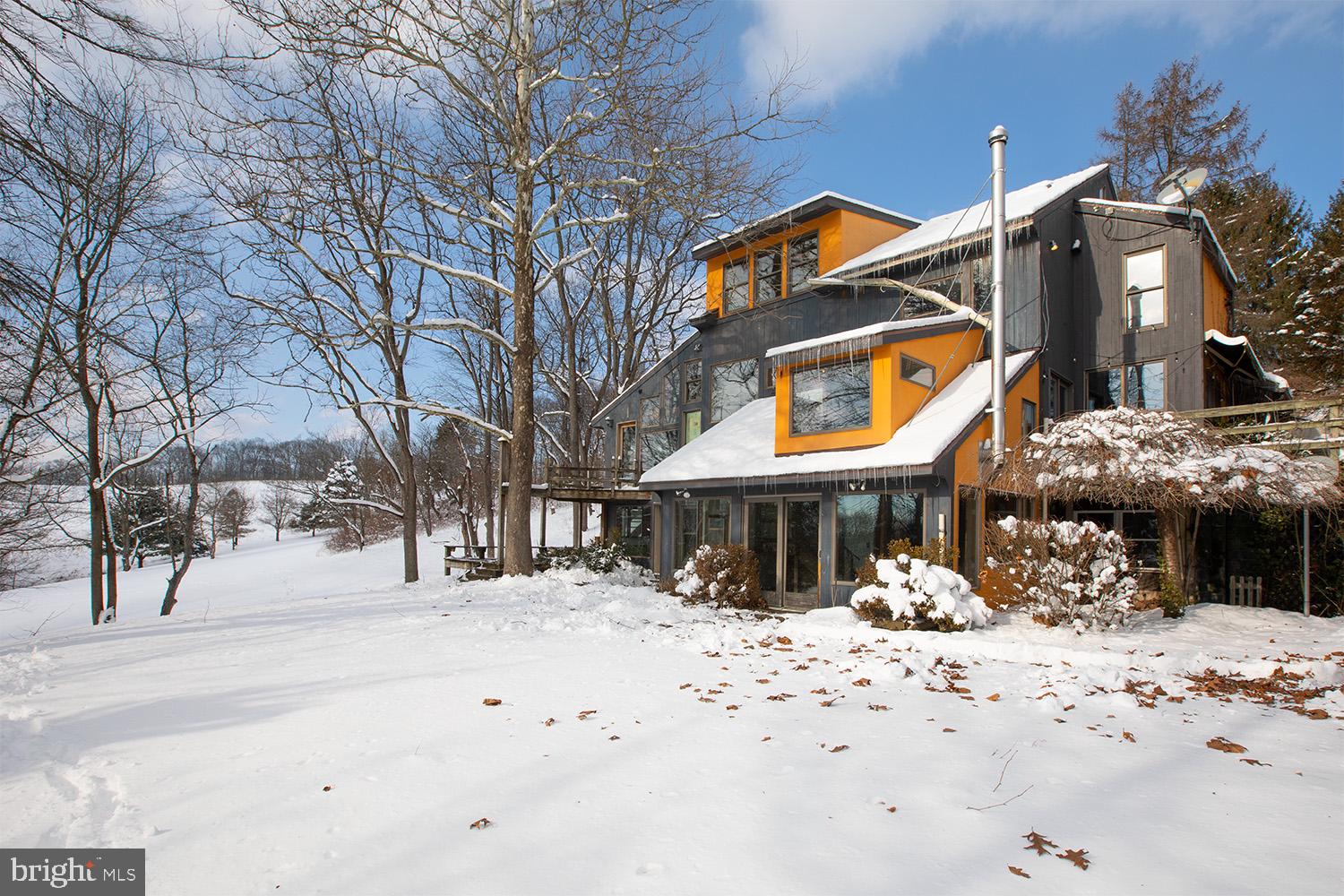 220 Dietrich Road Kempton, PA 19529 - Photo 4 of 90 a front view of a building with snow on the road