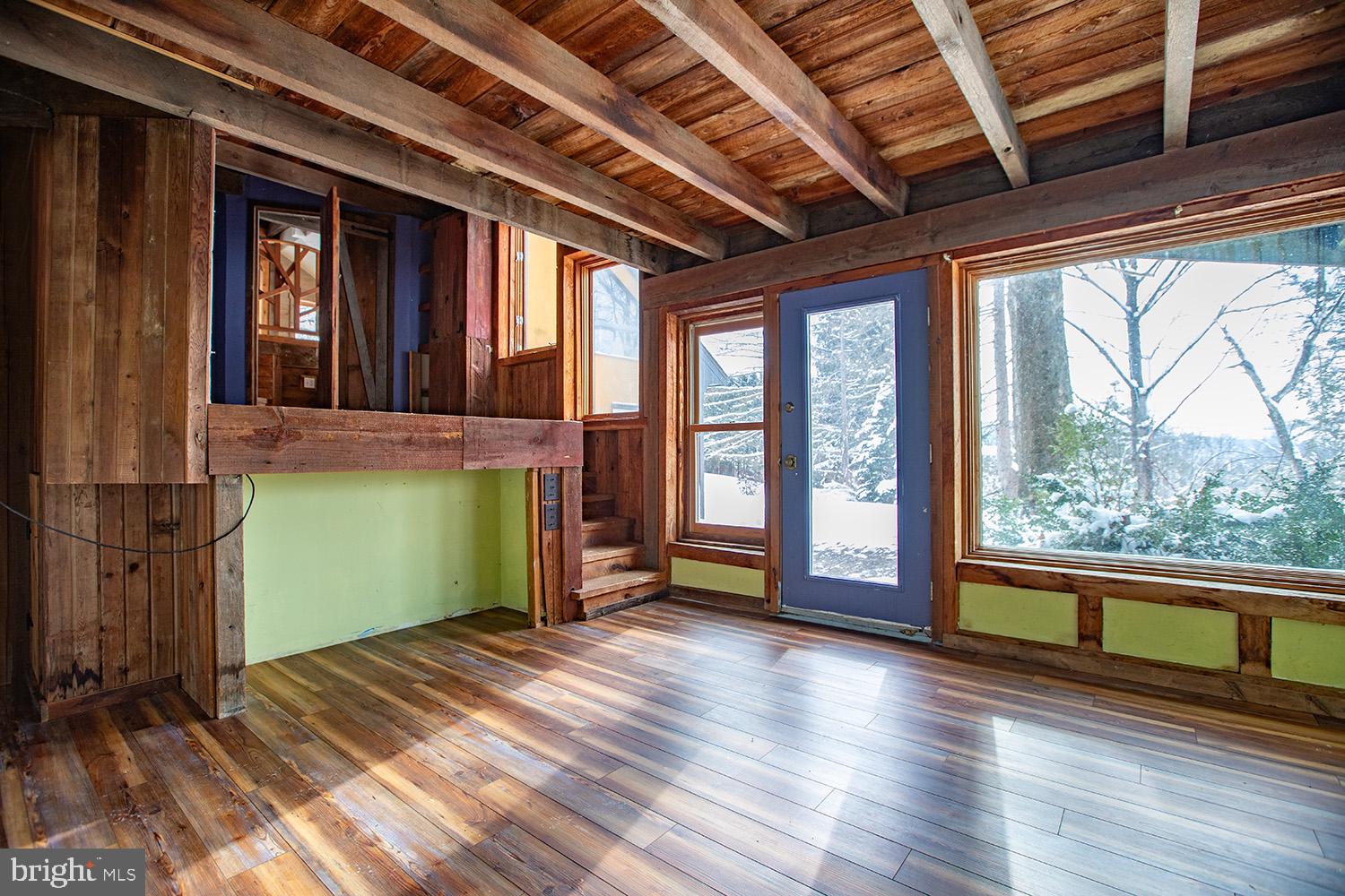 220 Dietrich Road Kempton, PA 19529 - Photo 44 of 90 a view of empty room with wooden floor and fan