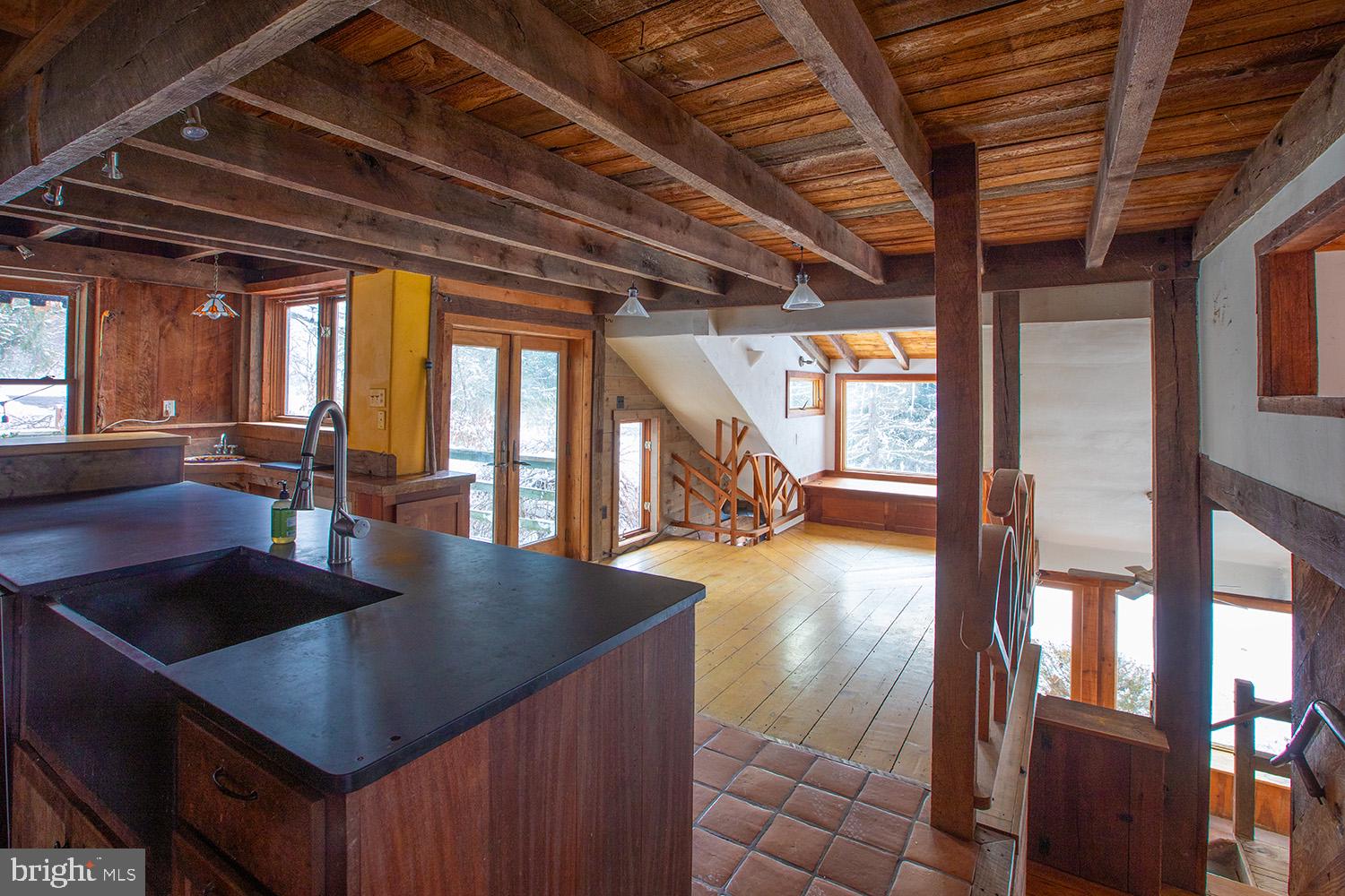 220 Dietrich Road Kempton, PA 19529 - Photo 52 of 90 a view of kitchen and dining room with wooden floor