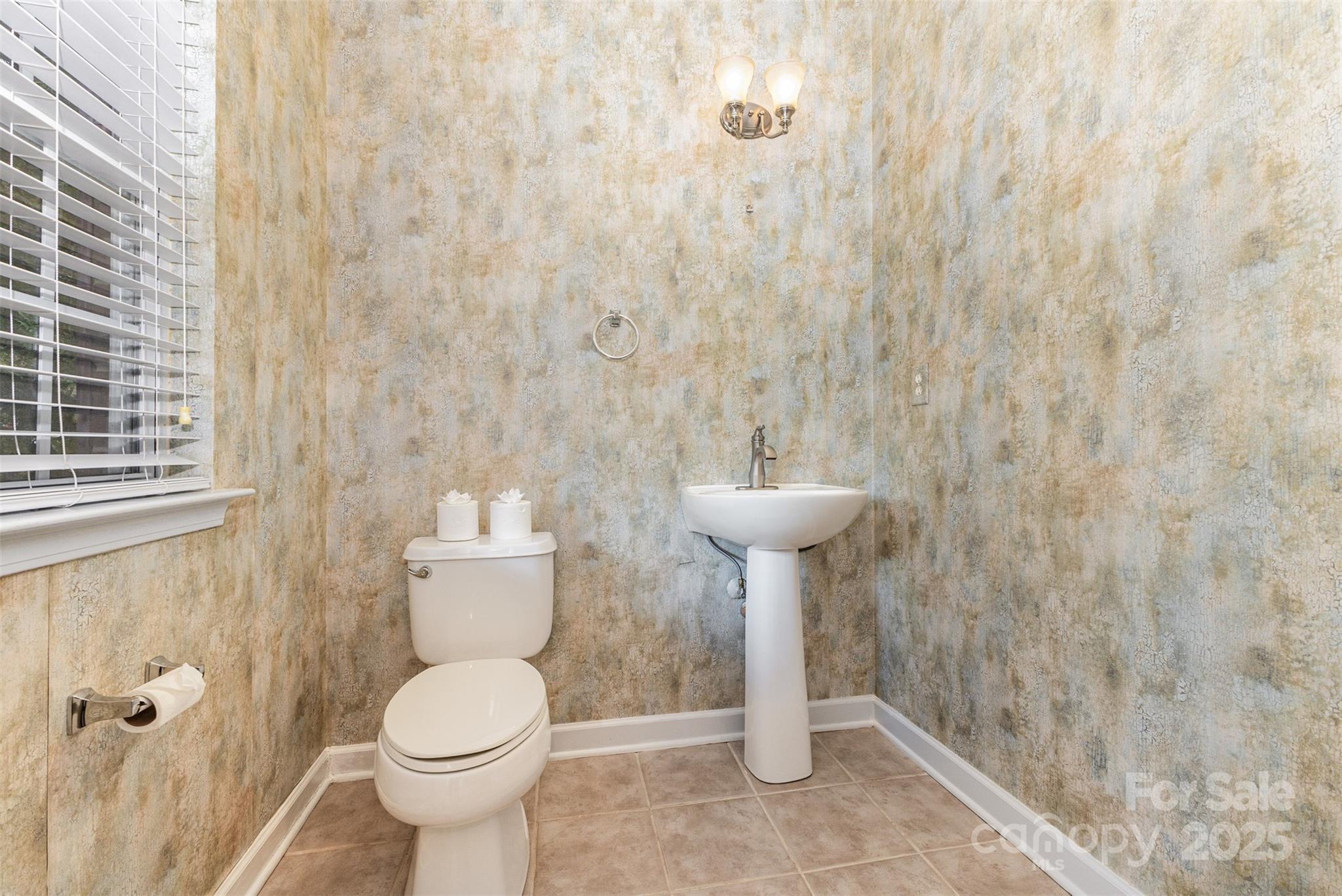 445 Buttermere Road Fort Mill, SC 29715 - Photo 11 of 42 a bathroom with a sink toilet and a mirror