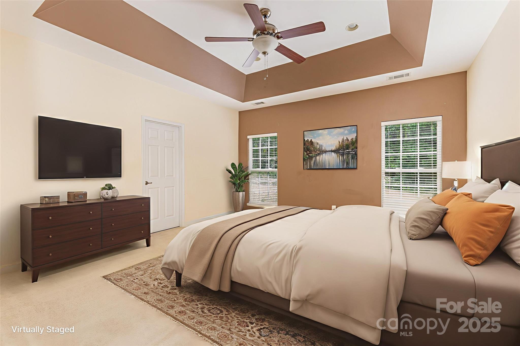 445 Buttermere Road Fort Mill, SC 29715 - Photo 12 of 35 a bedroom with a bed and a flat screen tv