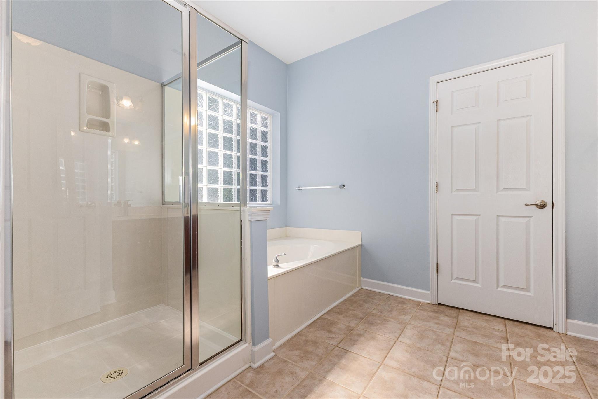 445 Buttermere Road Fort Mill, SC 29715 - Photo 16 of 35 a bathroom with a bathtub and a shower