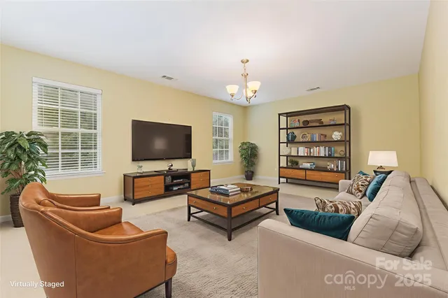 a white bath tub sitting next to a white sink and vanity