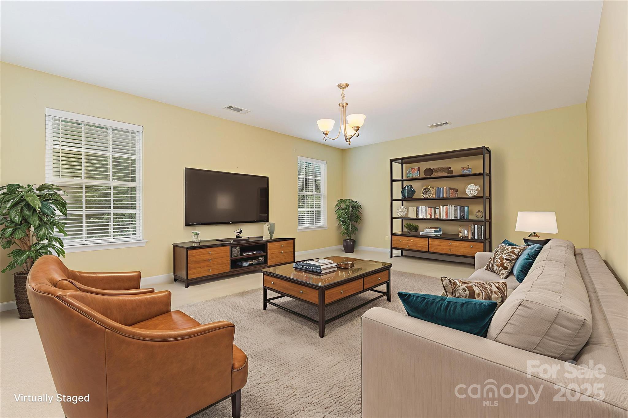 445 Buttermere Road Fort Mill, SC 29715 - Photo 18 of 35 a living room with furniture and a flat screen tv